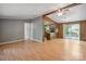Open living area with wood-look floors, light gray walls, and partial wood-paneled walls, seamlessly connecting living spaces at 351 Fletcher Rd, Union Grove, NC 28689
