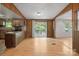 Inviting living area showcasing rustic wood paneling, sliding glass doors to the deck, and functional layout at 351 Fletcher Rd, Union Grove, NC 28689