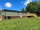 Spacious backyard featuring a wooden deck and mature trees at 353 Quail Pointe Dr, Salisbury, NC 28147