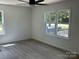 Bright bedroom with large windows and modern ceiling fan at 353 Quail Pointe Dr, Salisbury, NC 28147