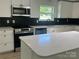 Bright kitchen featuring updated countertops, cabinets, and stainless steel appliances at 353 Quail Pointe Dr, Salisbury, NC 28147