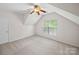 Bright bedroom with neutral carpet, a ceiling fan, and a window bringing in natural light at 404 Basingdon Ct, Waxhaw, NC 28173