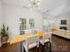 Cozy dining area featuring modern lighting and access to an outdoor patio at 404 Basingdon Ct, Waxhaw, NC 28173