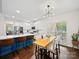 Bright kitchen with a large island, stainless steel appliances, and adjacent dining area at 404 Basingdon Ct, Waxhaw, NC 28173