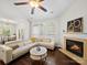 Vaulted ceiling in this spacious living room with a fireplace, hardwood floors, and lots of natural light at 404 Basingdon Ct, Waxhaw, NC 28173