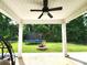 Backyard showcasing a trampoline and a stone fire pit, viewed from a covered patio area at 413 Hunton Forest Dr, Concord, NC 28027