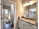 This bathroom features dual access to the shower and closet, along with a modern vanity at 413 Hunton Forest Dr, Concord, NC 28027