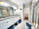 Bathroom featuring a double sink vanity, and walk in shower with glass door at 413 Hunton Forest Dr, Concord, NC 28027