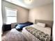 This bedroom features a window, an area rug, and two beds: a standard bed and a car bed at 413 Hunton Forest Dr, Concord, NC 28027