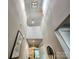 Bright, open two-story foyer with elegant decor and hardwood floors at 413 Hunton Forest Dr, Concord, NC 28027