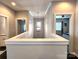Open hallway with natural light, connecting various rooms and creating a sense of flow and spaciousness throughout the home at 413 Hunton Forest Dr, Concord, NC 28027