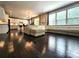 Spacious living room features hardwood floors and an open floor plan to kitchen and dining area at 413 Hunton Forest Dr, Concord, NC 28027