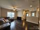 Open living room with hardwood floors, neutral paint, and plenty of natural light at 413 Hunton Forest Dr, Concord, NC 28027