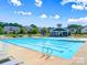 Enjoy the community pool, complete with lap lanes, lounge chairs, and a nearby clubhouse at 413 Hunton Forest Dr, Concord, NC 28027