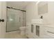Bathroom featuring a vanity with white cabinets and a walk-in glass shower at 4410 Laurel Twig Ct, Charlotte, NC 28215