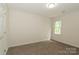 Bedroom featuring a standard closet, neutral walls, carpet floor, and bright window at 4410 Laurel Twig Ct, Charlotte, NC 28215