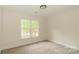 Bedroom with plush carpet and bright, natural light at 4410 Laurel Twig Ct, Charlotte, NC 28215