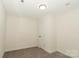 Bedroom showcasing a standard closet, neutral walls, and carpet floor at 4410 Laurel Twig Ct, Charlotte, NC 28215