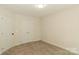 Bedroom featuring a double door closet, neutral walls, and carpet floor at 4410 Laurel Twig Ct, Charlotte, NC 28215