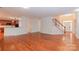 Open concept living space with hardwood floors and staircase at 4410 Laurel Twig Ct, Charlotte, NC 28215