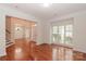 Spacious living room with hardwood floors, a large window and views of the entry and dining room at 4410 Laurel Twig Ct, Charlotte, NC 28215