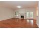 Bright living room with a fireplace and hardwood floors at 4410 Laurel Twig Ct, Charlotte, NC 28215