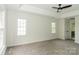 Main bedroom with tray ceilings, neutral walls, carpet floor, and natural light at 4410 Laurel Twig Ct, Charlotte, NC 28215