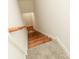 Carpeted stairway leading to hardwood floor landing area at 4410 Laurel Twig Ct, Charlotte, NC 28215