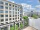Scenic balcony view featuring nearby corporate towers and lush greenery in the surrounding area at 4625 Piedmont Row Dr # 701, Charlotte, NC 28210