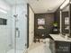 Stylish bathroom with a marble countertop, walk-in shower, and unique wall decor at 4625 Piedmont Row Dr # 701, Charlotte, NC 28210