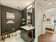 Modern bathroom with unique wallpaper, elegant vanity, and ample storage space at 4625 Piedmont Row Dr # 701, Charlotte, NC 28210