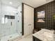 Well-lit bathroom showcasing a frameless glass shower, marble floors, and modern fixtures at 4625 Piedmont Row Dr # 701, Charlotte, NC 28210