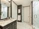Sleek bathroom featuring a marble vanity, modern fixtures, and a walk-in shower at 4625 Piedmont Row Dr # 701, Charlotte, NC 28210