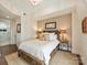 Well-lit bedroom showcasing warm lighting, a comfortable bed, and modern decor at 4625 Piedmont Row Dr # 701, Charlotte, NC 28210
