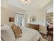 Bright bedroom showcasing a large bed, bedside table, and a window offering natural light at 4625 Piedmont Row Dr # 701, Charlotte, NC 28210