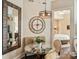 Cozy breakfast nook with a glass-top table and comfortable seating, with a view through to the Primary bedroom at 4625 Piedmont Row Dr # 701, Charlotte, NC 28210