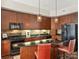 Modern kitchen with granite counters, stainless steel appliances, and island seating for casual dining, enhancing functionality and style at 4625 Piedmont Row Dr # 701, Charlotte, NC 28210