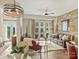 Bright living room features a modern design with exposed brick and balcony access at 4625 Piedmont Row Dr # 701, Charlotte, NC 28210