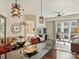 Bright kitchen flowing into living room with access to balcony, creating a perfect space for relaxing and enjoying city views at 4625 Piedmont Row Dr # 701, Charlotte, NC 28210
