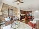 Open concept living room showcasing exposed brick wall and flows into modern kitchen area at 4625 Piedmont Row Dr # 701, Charlotte, NC 28210