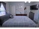 Cozy bedroom with bed, dresser, and window, offering a comfortable personal space at 515 Upper Spencer Mountain Rd, Stanley, NC 28164