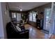 Inviting dining area with hardwood floors, glass table set, and ample natural light at 515 Upper Spencer Mountain Rd, Stanley, NC 28164
