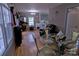 Open dining area featuring hardwood floors and connection to the kitchen at 515 Upper Spencer Mountain Rd, Stanley, NC 28164