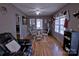 Cozy dining area with hardwood floors, chandelier, and a view into another room at 515 Upper Spencer Mountain Rd, Stanley, NC 28164