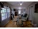 Bright dining area showcases a glass table set and views throughout the home at 515 Upper Spencer Mountain Rd, Stanley, NC 28164
