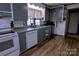 Classic kitchen with white appliances, laminate countertop, and bright natural lighting at 515 Upper Spencer Mountain Rd, Stanley, NC 28164