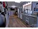 Functional kitchen featuring laminate floors, neutral cabinets, and standard appliances at 515 Upper Spencer Mountain Rd, Stanley, NC 28164