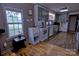 Efficient kitchen layout with grey cabinetry, updated appliances, and hardwood floors at 515 Upper Spencer Mountain Rd, Stanley, NC 28164