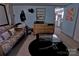 Relaxing living room with couch and coffee table at 515 Upper Spencer Mountain Rd, Stanley, NC 28164
