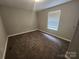 Carpeted bedroom with a window and natural light at 544 Bentley Rd, Shelby, NC 28152